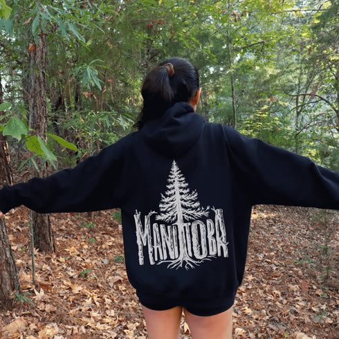 Celebrate the wild spirit of Manitoba with this eye-catching hoodie featuring "Manitoba" written in a unique tree branch font.